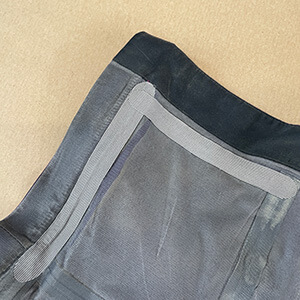 Bande étanche sur une veste technique