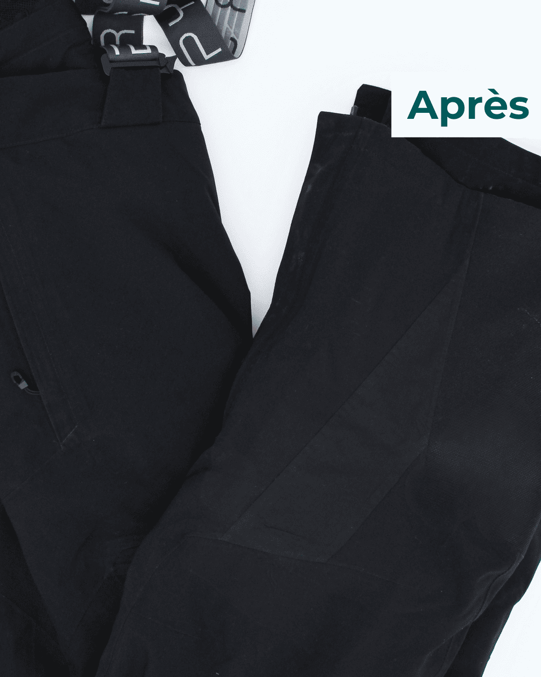 Pantalon de ski réparé avec un empiècement cousu et bandes étanches thermocollées.